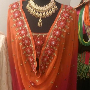 Deatails of a Indian sari richly decorated with beads and fabrics